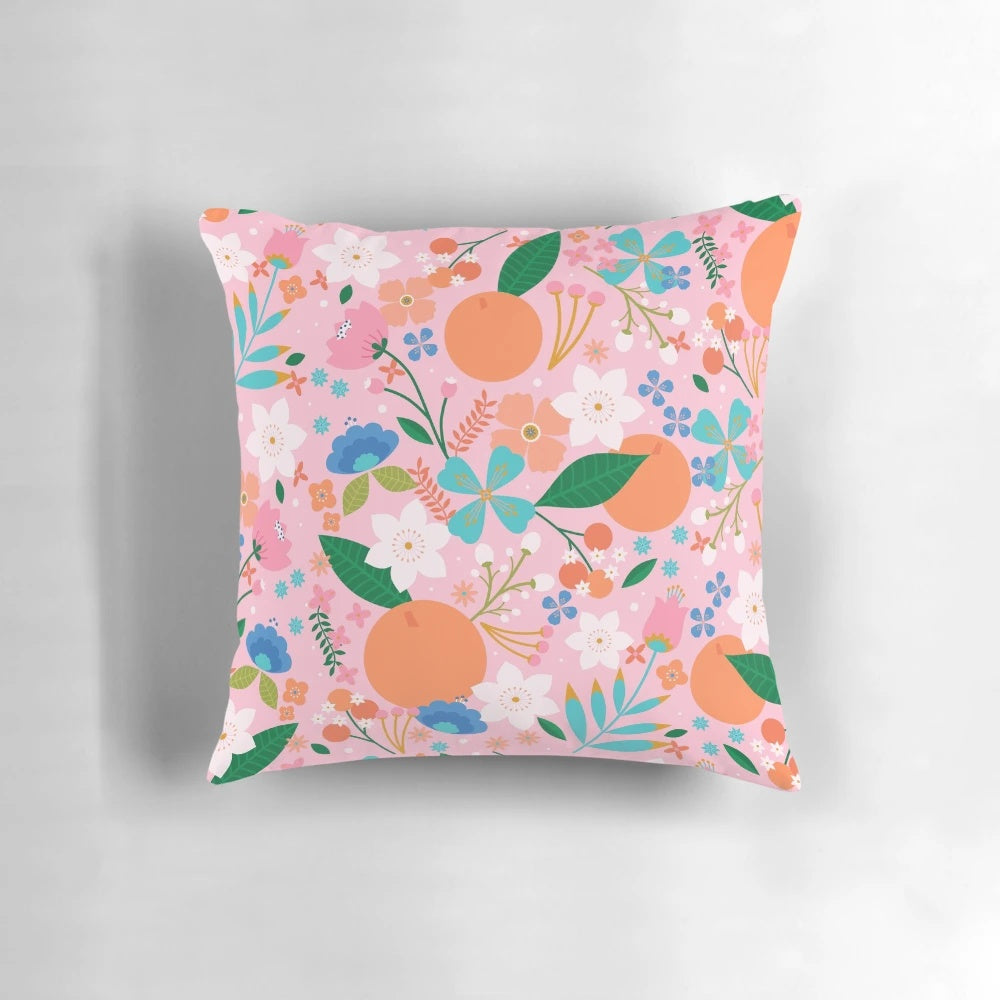 Soft, plush orange blossom-patterned decorative throw pillow for cozy summer home accents
