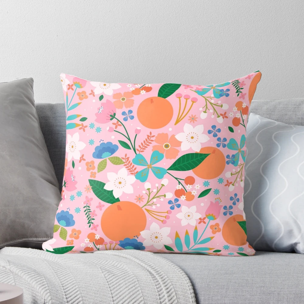 Soft, plush orange blossom-patterned decorative throw pillow for cozy summer home accents