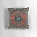 A plush, decorative Persian-style pillow in a rich, mystic red color.