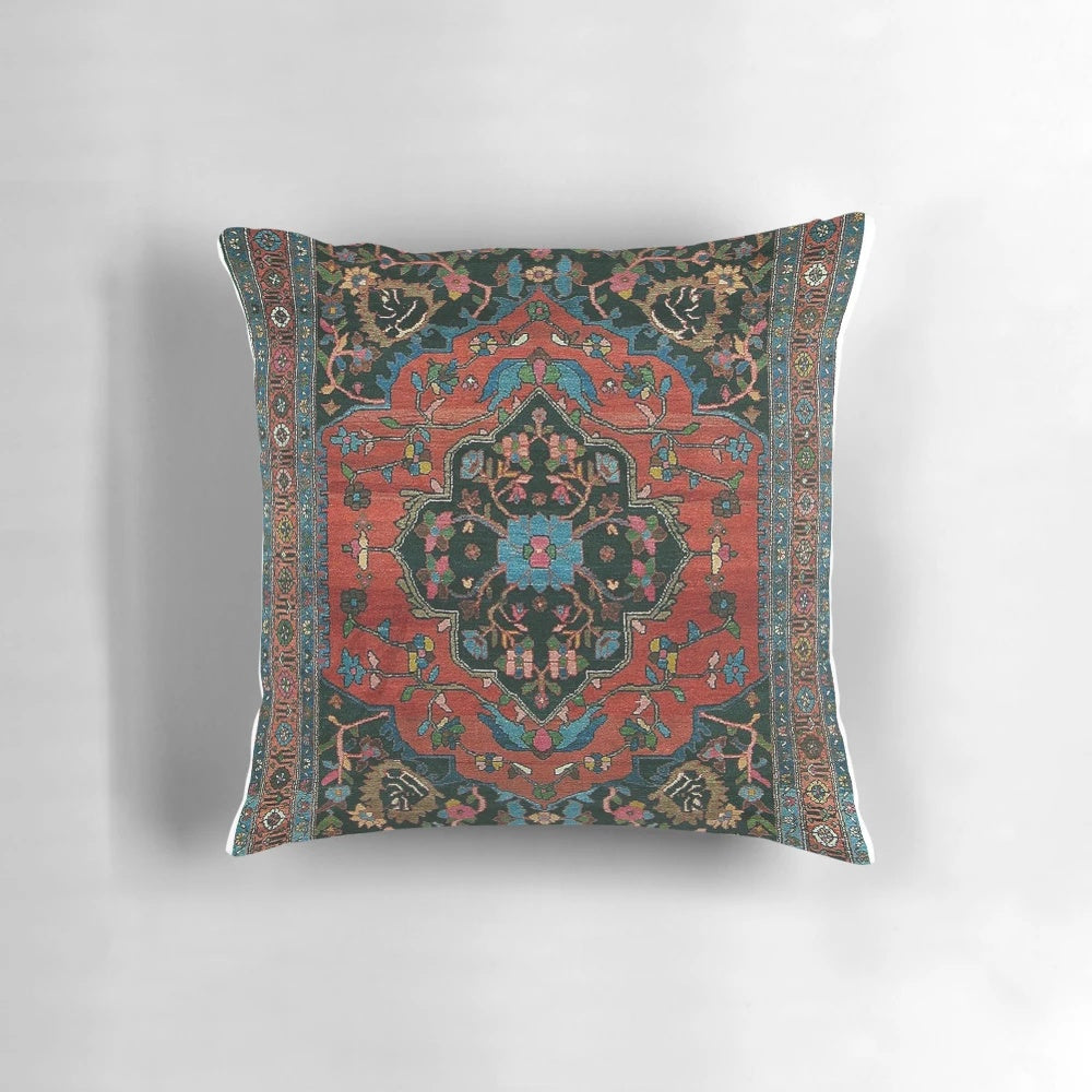 A plush, decorative Persian-style pillow in a rich, mystic red color.
