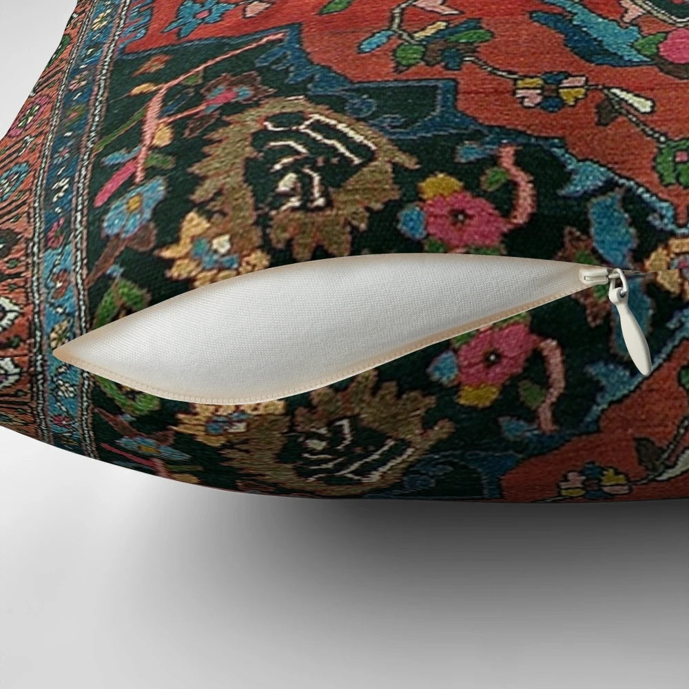 A plush, decorative Persian-style pillow in a rich, mystic red color.