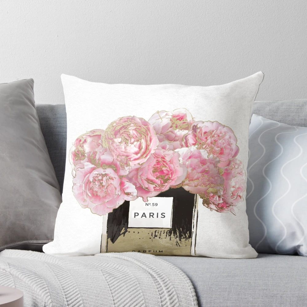 Plush pink peony scented pillow with golden accents, inspired by the allure of Parisian perfumes.