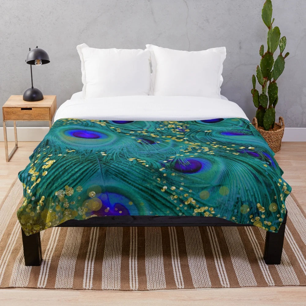Plush blanket featuring a dreamy peacock feather design in teal, purple, and glimmering gold