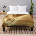 Plush blanket with music sheet design in liquid gold