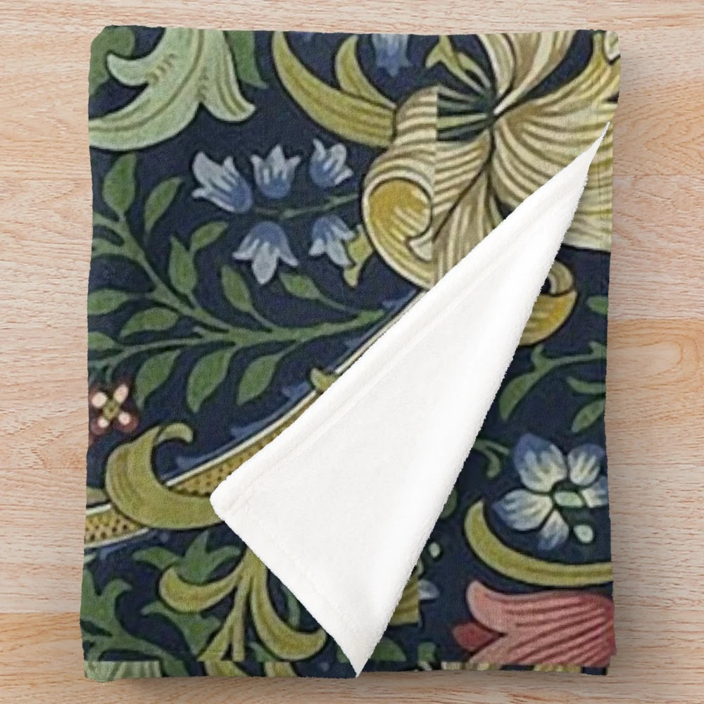 Plush blanket featuring the iconic golden lily floral pattern designed by British artist William Morris