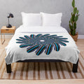 Plush, cozy blanket with a vibrant, symmetrical designer print