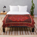 Red Persian-inspired plush blanket with antique rug design