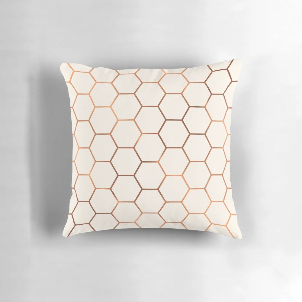 Rose gold copper honeycomb decorative pillow with a shimmering foil design