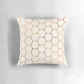 Rose gold copper honeycomb decorative pillow with a shimmering foil design