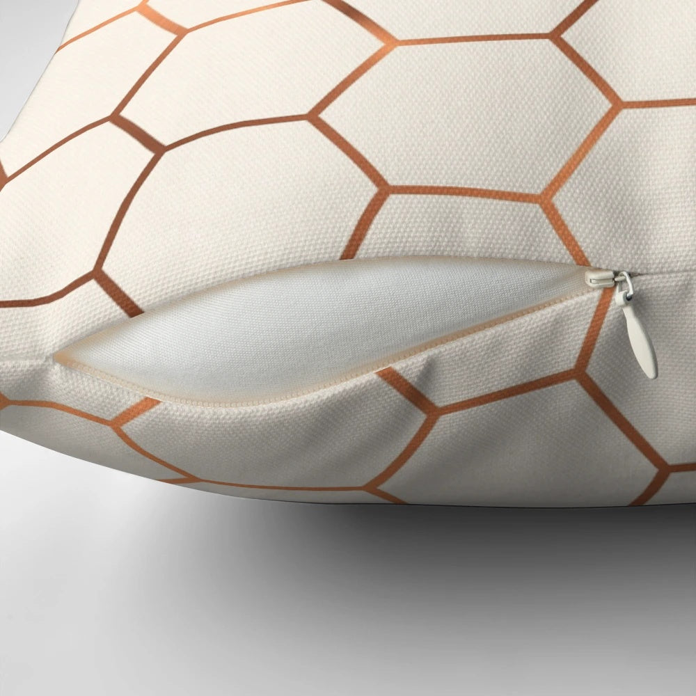 Rose gold copper honeycomb decorative pillow with a shimmering foil design