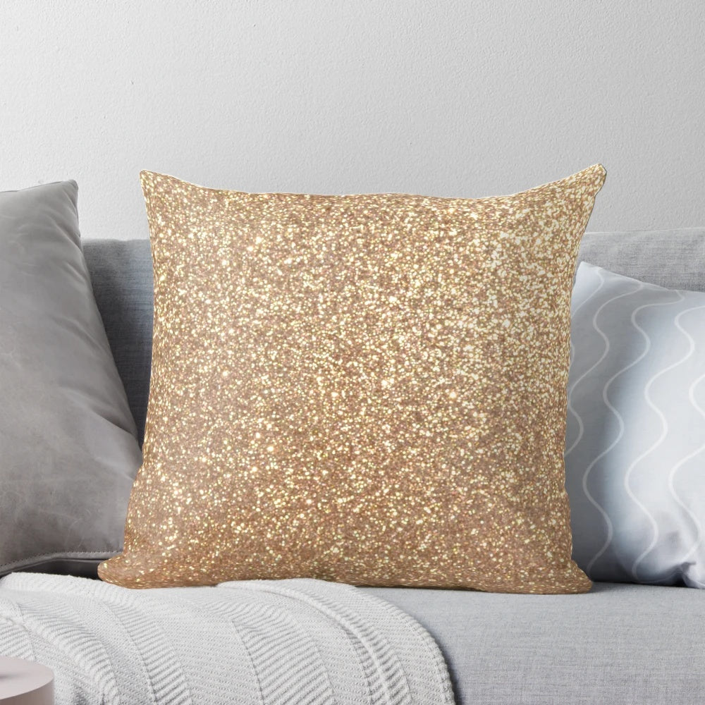 Close-up of a soft, shimmering rose gold metallic pillow with a glittery finish.