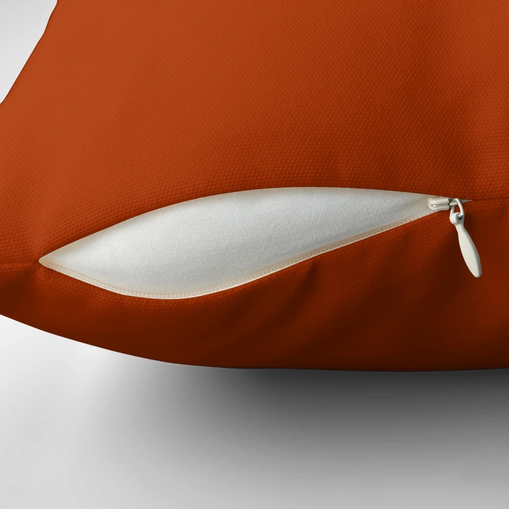 Solid rust colored pillow for a warm, inviting home