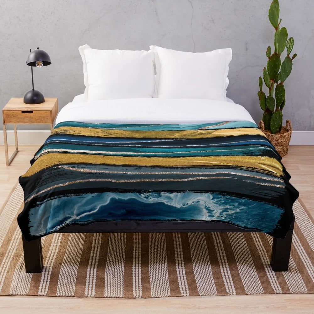Teal and gold brushstroke plush blanket with abstract art design