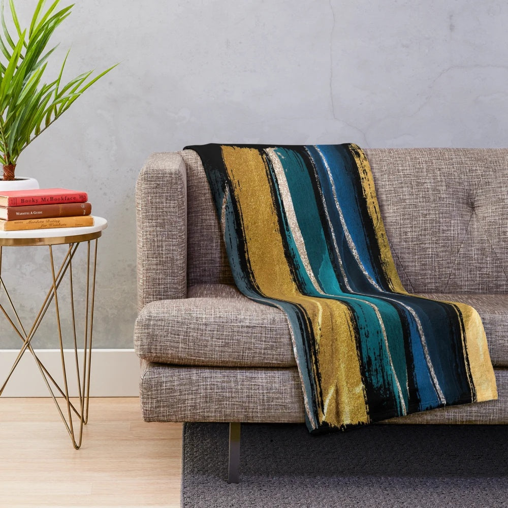 Teal and gold brushstroke plush blanket with abstract art design