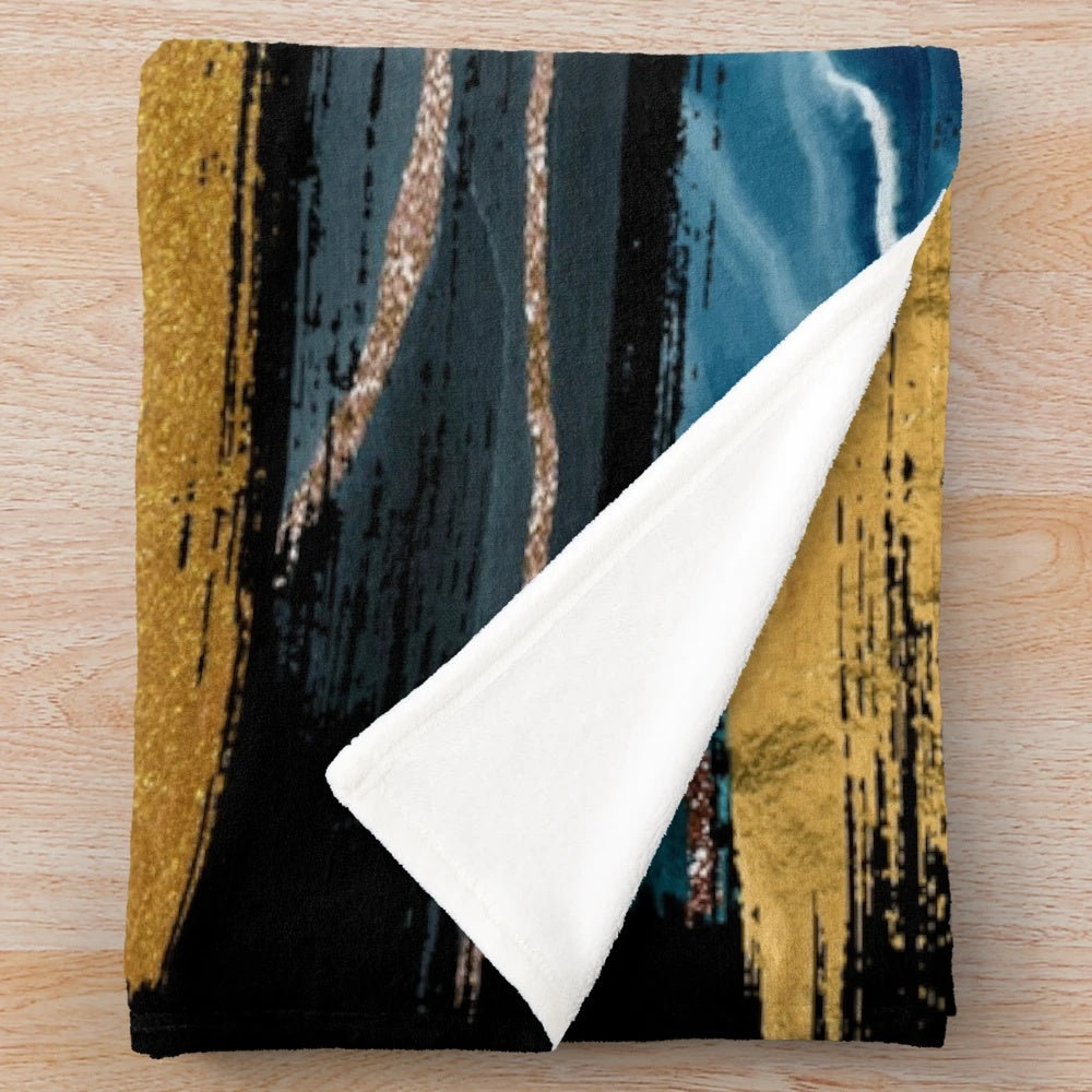 Teal and gold brushstroke plush blanket with abstract art design
