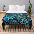 Teal plush blanket with tropical floral and oceanic patterns