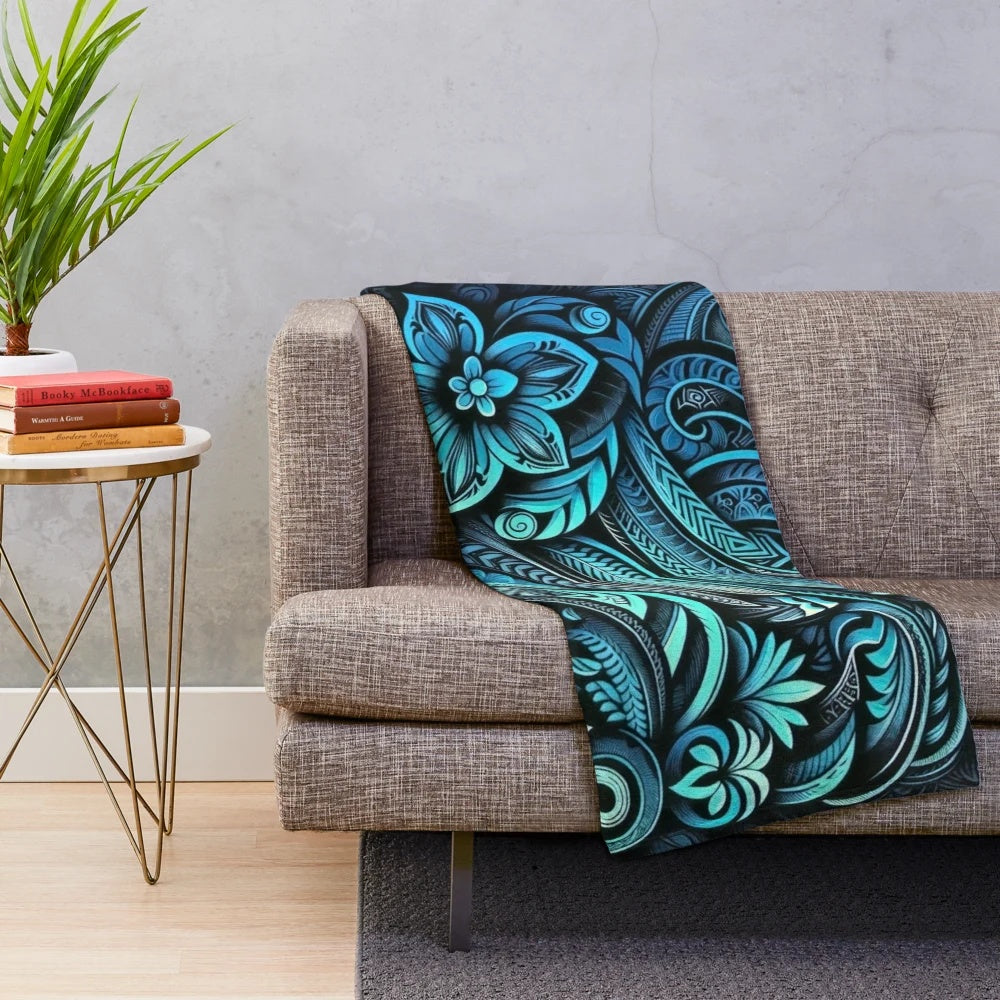 Teal plush blanket with tropical floral and oceanic patterns
