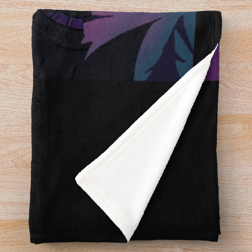 Caylus plush blanket in a cozy living room setting