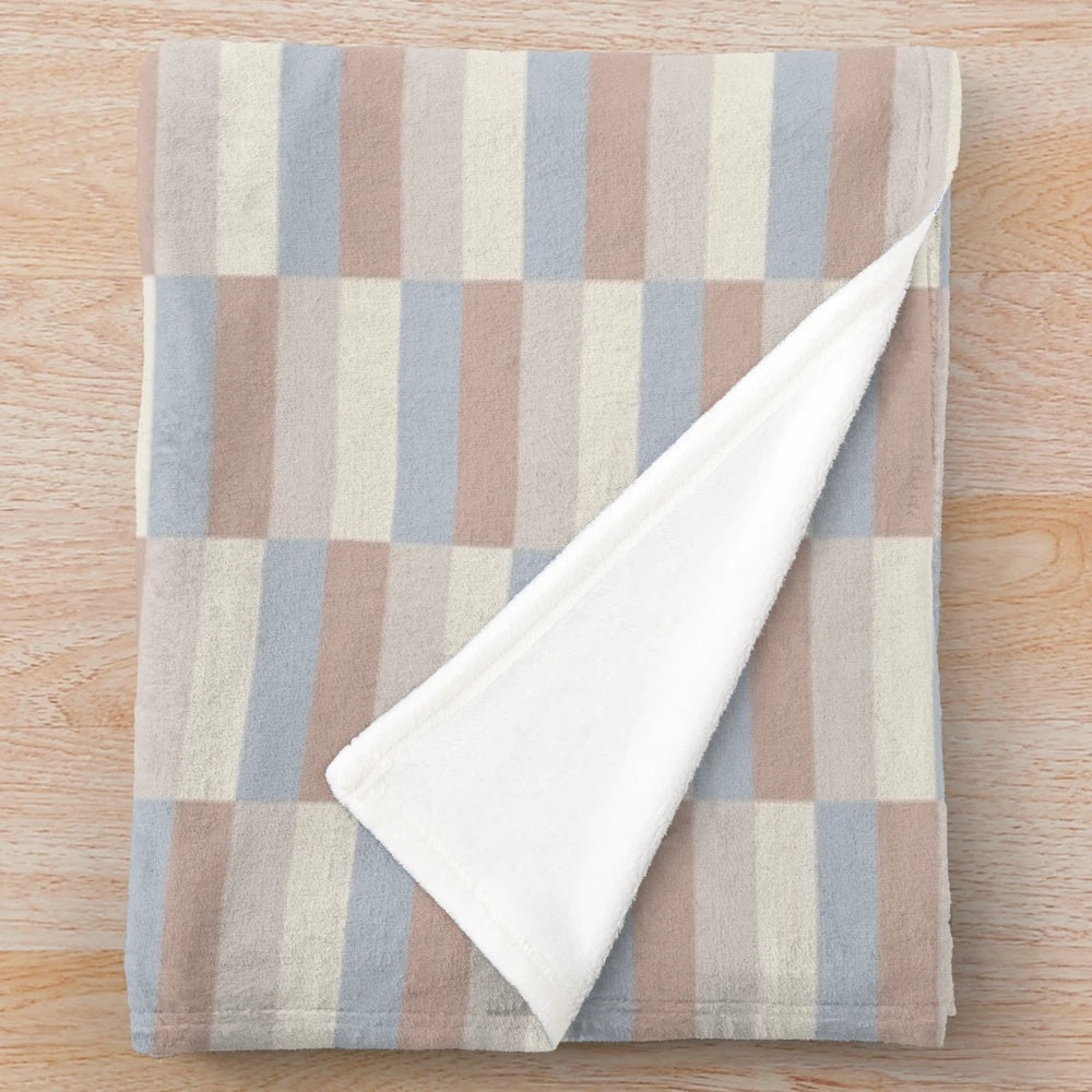 Plush blanket in a neutral river rock color pattern