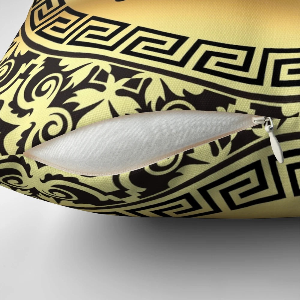 Ornate baroque-style black and gold throw pillow with Greek key pattern design