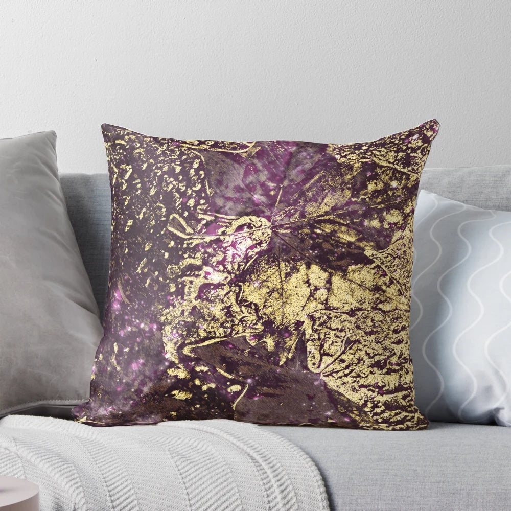 Luxury pillow featuring abstract design of purple and gold leaves
