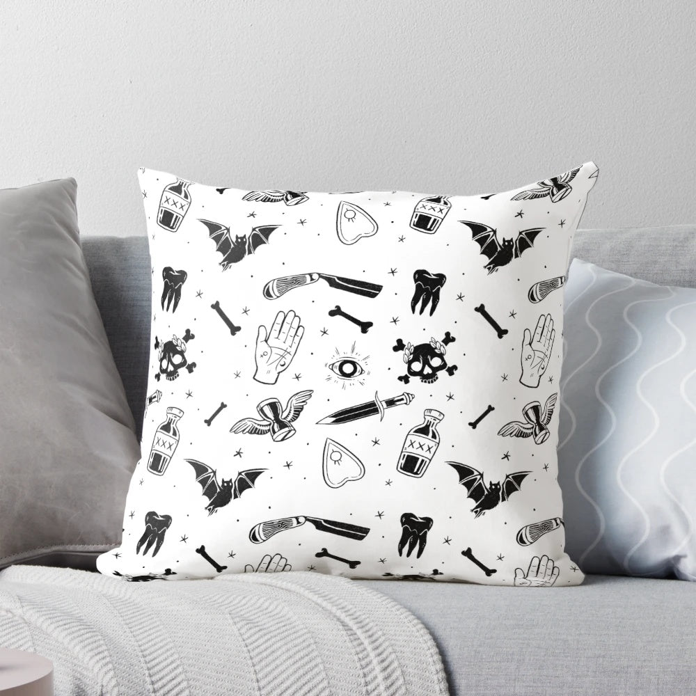 A decorative pillow featuring a moody, mysterious design with gothic and macabre elements like skulls, bats, and occult symbols.