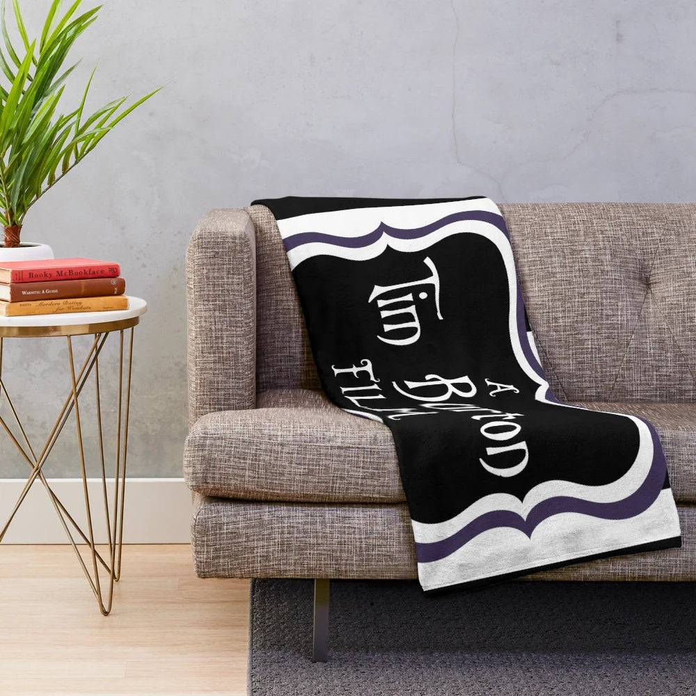 Black and white striped plush blanket with a gothic, creepy aesthetic