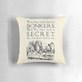 Decorative throw pillow featuring the quote "You're entirely bonkers" from the Mad Hatter in Alice in Wonderland.