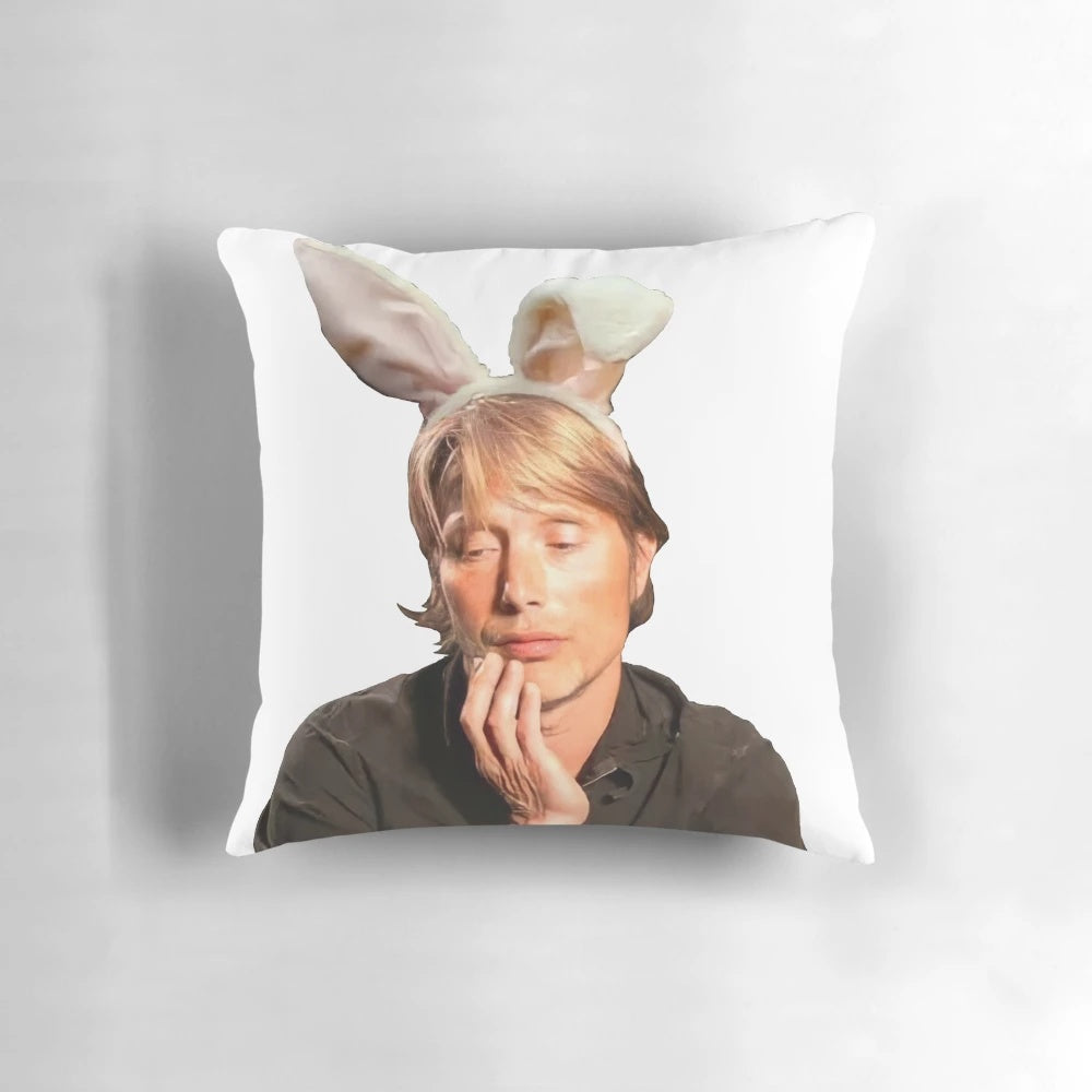 Mads Mikkelsen as Hannibal Lecter with bunny ears on a stylish pillow