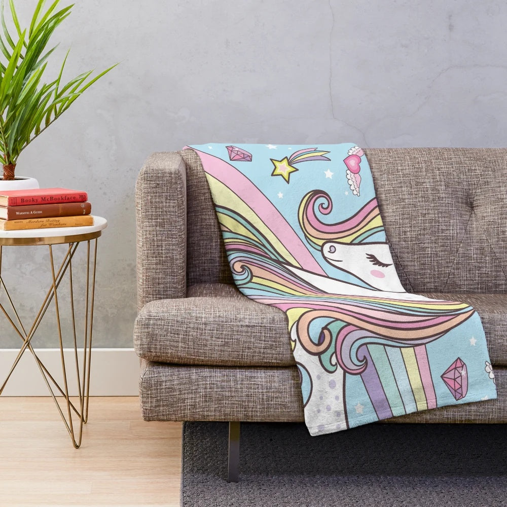 Soft and cozy blue plush unicorn blanket with rainbow and stars