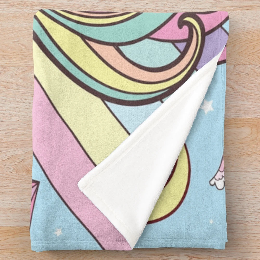Soft and cozy blue plush unicorn blanket with rainbow and stars