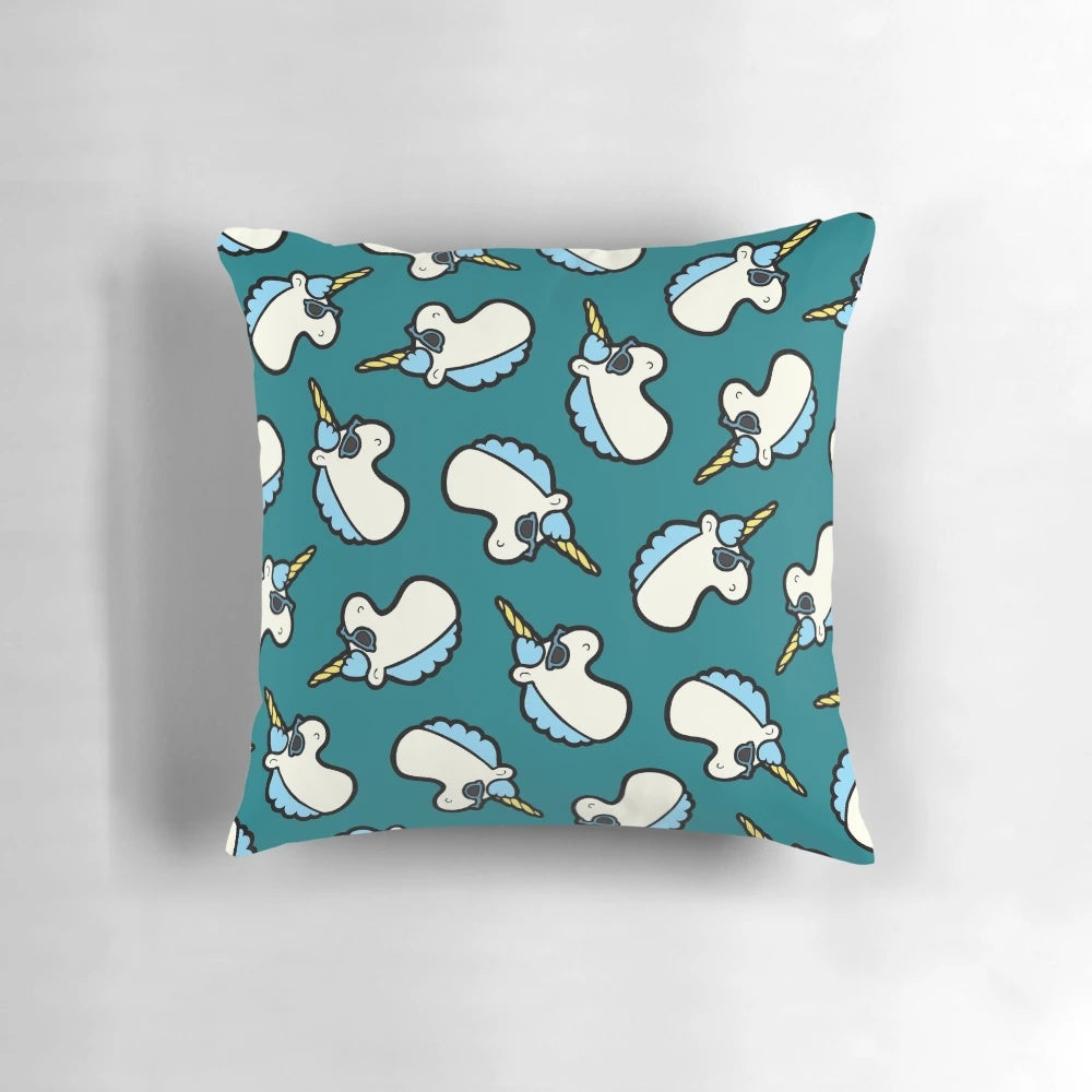 A blue pillow featuring a cool unicorn design with sunglasses