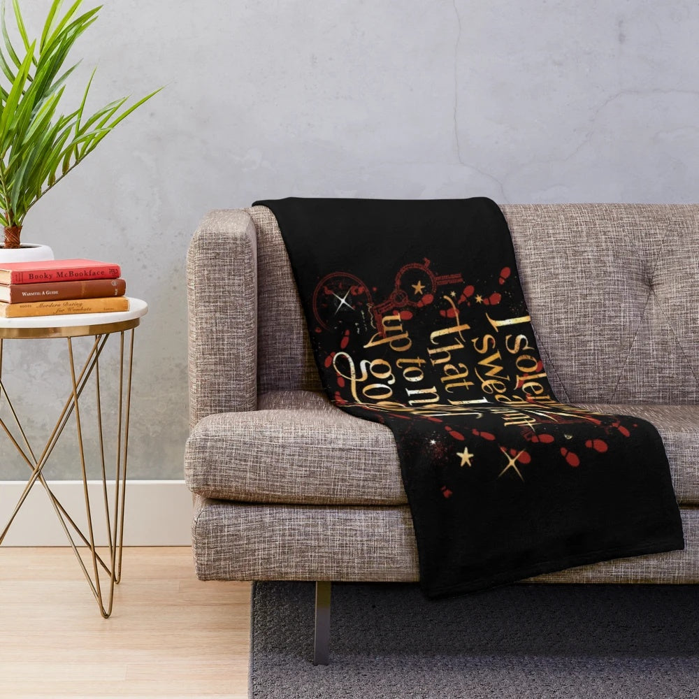 Plush blanket featuring magical creatures like ravens, snakes, and dragons