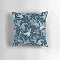 A blue decorative pillow featuring a whimsical dragon surrounded by a watercolor snowflake design, perfect for holiday and winter décor.