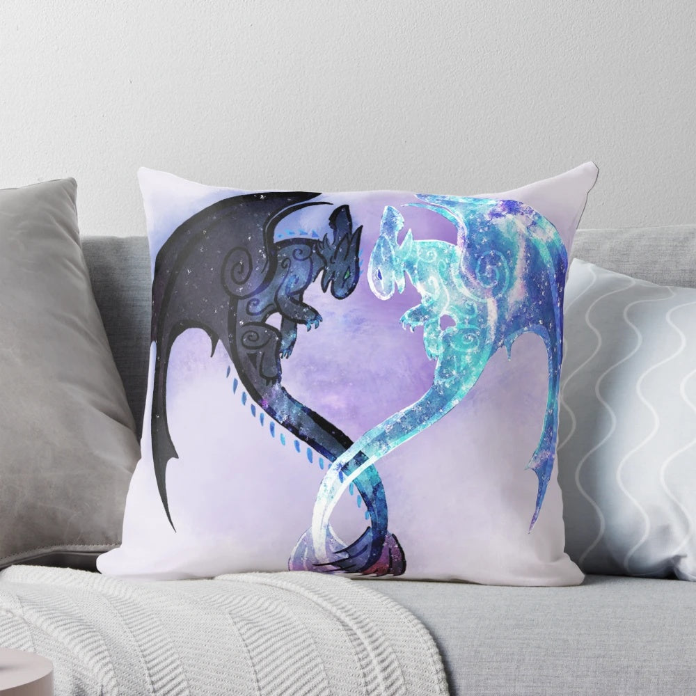 A decorative pillow featuring the dragon characters Toothless and Light Fury from the How to Train Your Dragon fantasy film series.