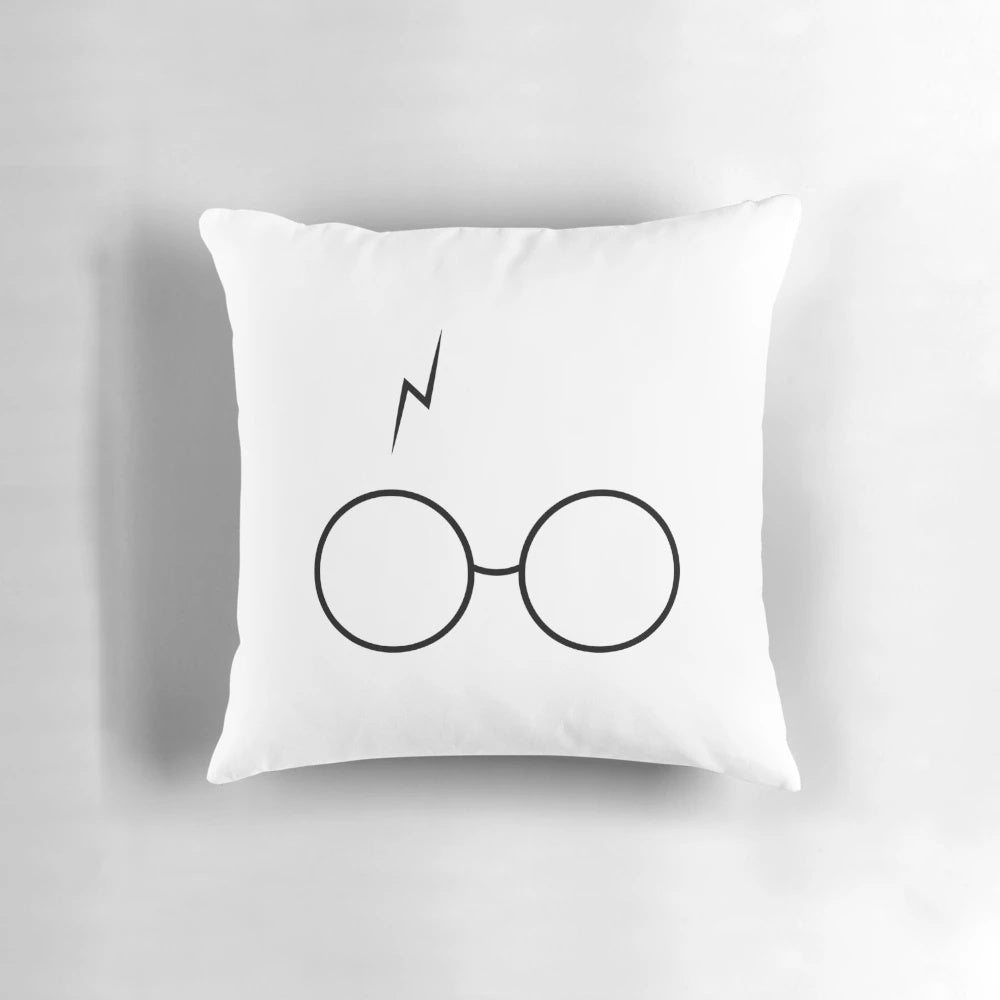 Pillow with a magical Harry Potter-inspired design featuring a silhouette of glasses and lightning