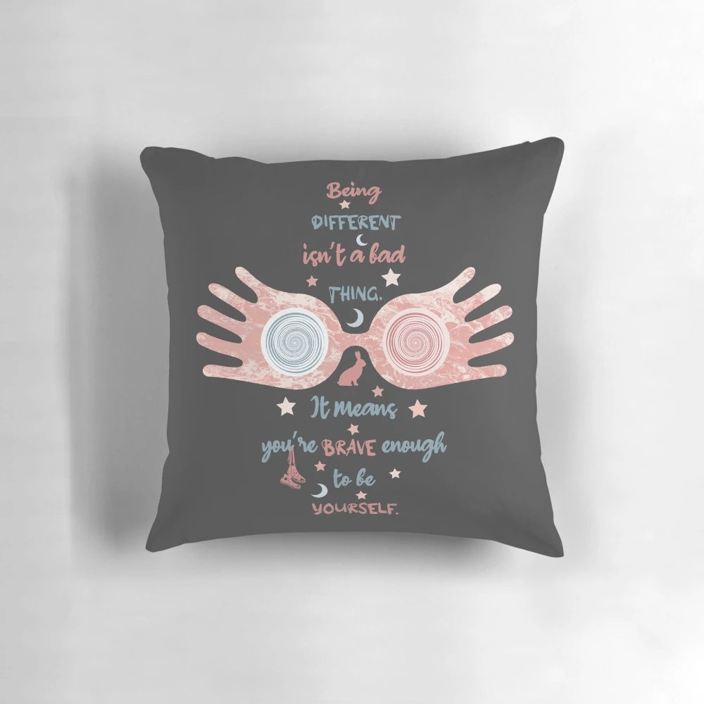 A plush, decorative pillow featuring the iconic wizard glasses of Luna Lovegood from the Harry Potter series.