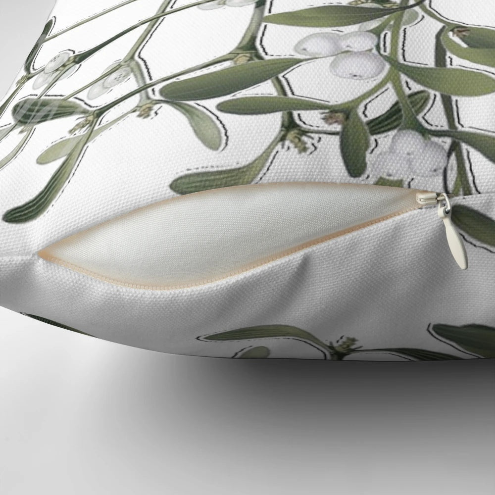 Soft white pillow with green mistletoe print, perfect for Christmas and winter decor