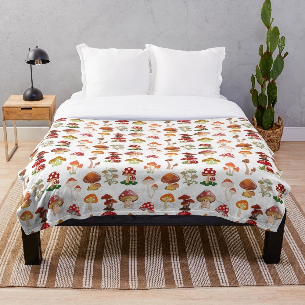 Cozy plush blanket with a seamless mushroom pattern design