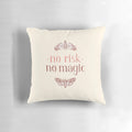 A decorative throw pillow featuring a handlettered "No Risk No Magic" quote with whimsical moth and butterfly illustrations.