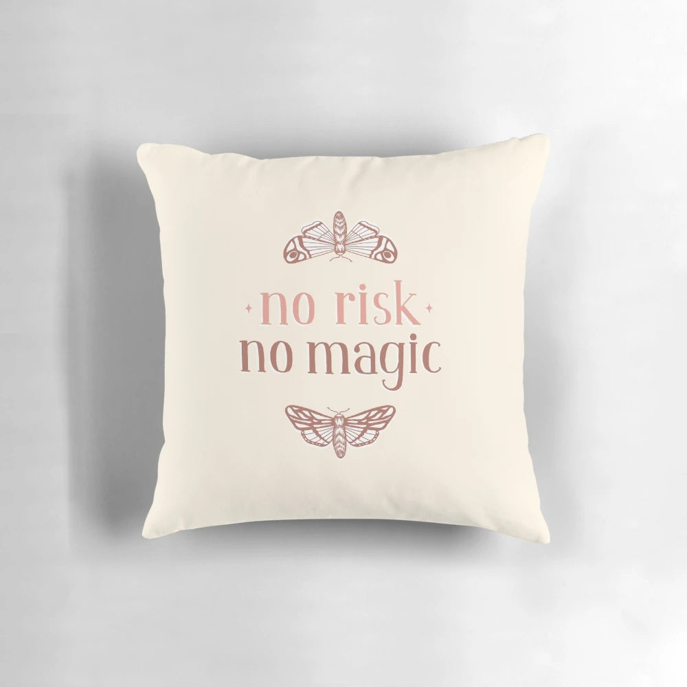 A decorative throw pillow featuring a handlettered "No Risk No Magic" quote with whimsical moth and butterfly illustrations.