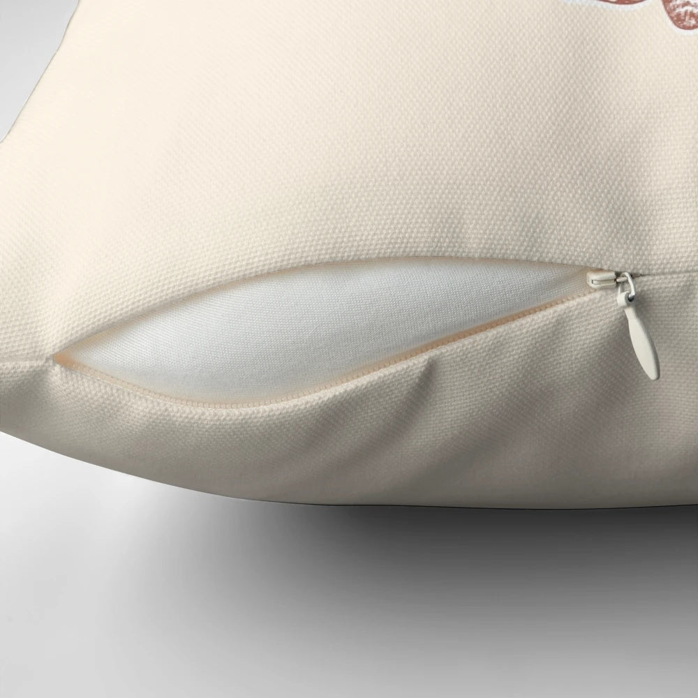 A decorative throw pillow featuring a handlettered "No Risk No Magic" quote with whimsical moth and butterfly illustrations.