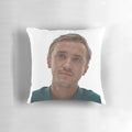 A soft, plush pillow featuring a portrait of Tom Felton as Draco Malfoy from the Harry Potter series.