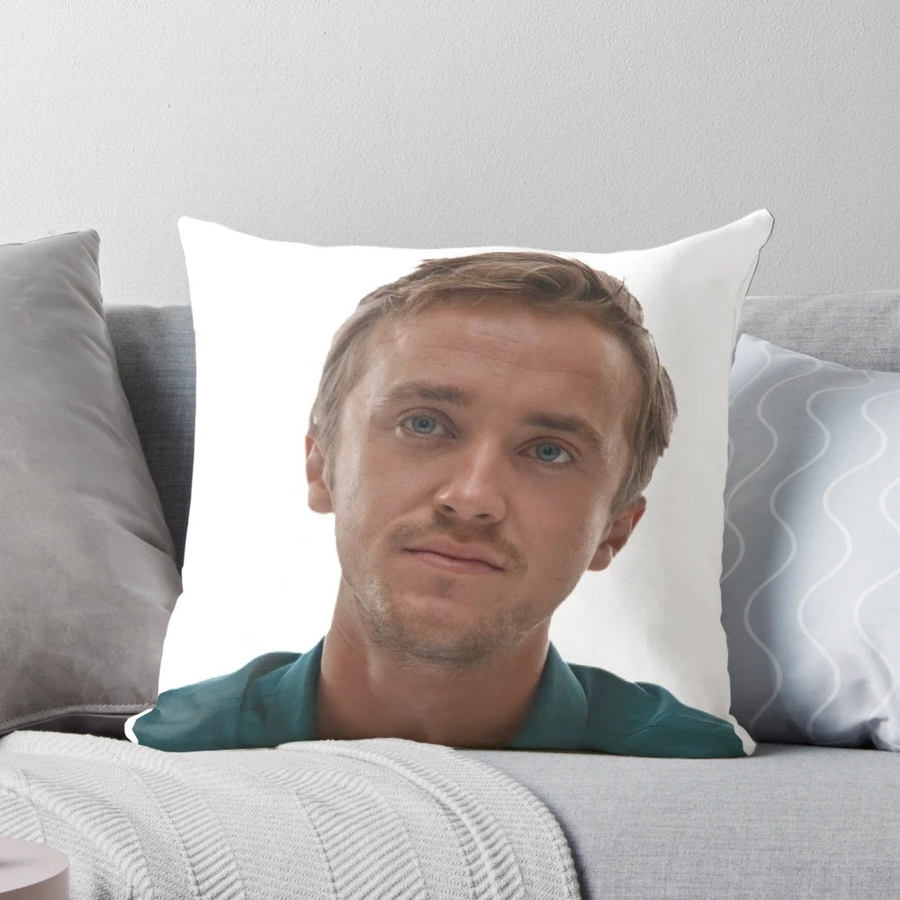 A soft, plush pillow featuring a portrait of Tom Felton as Draco Malfoy from the Harry Potter series.