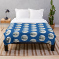 Plush blanket featuring a white unicorn and pegasus in a snowy, fantasy landscape