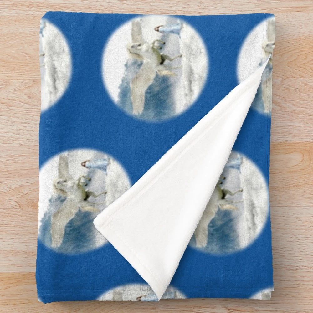 Plush blanket featuring a white unicorn and pegasus in a snowy, fantasy landscape