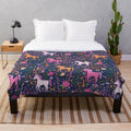 Soft and cozy plush blanket with a whimsical unicorn and floral design