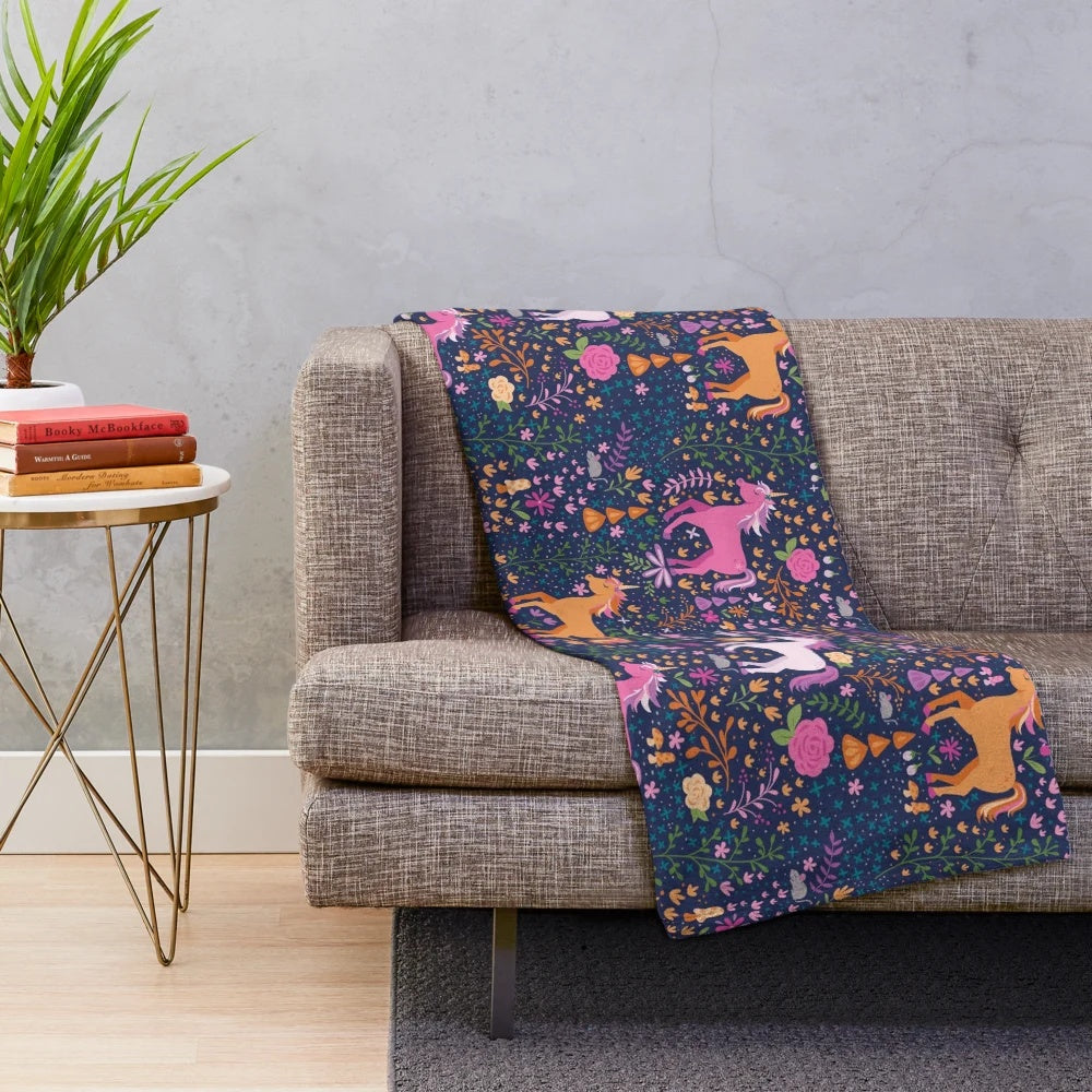 Soft and cozy plush blanket with a whimsical unicorn and floral design