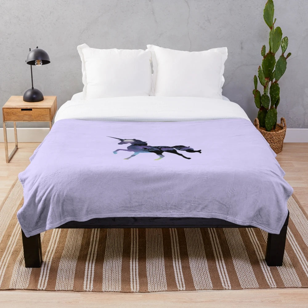 Soft and cozy unicorn plush blanket with a fantasy night sky landscape