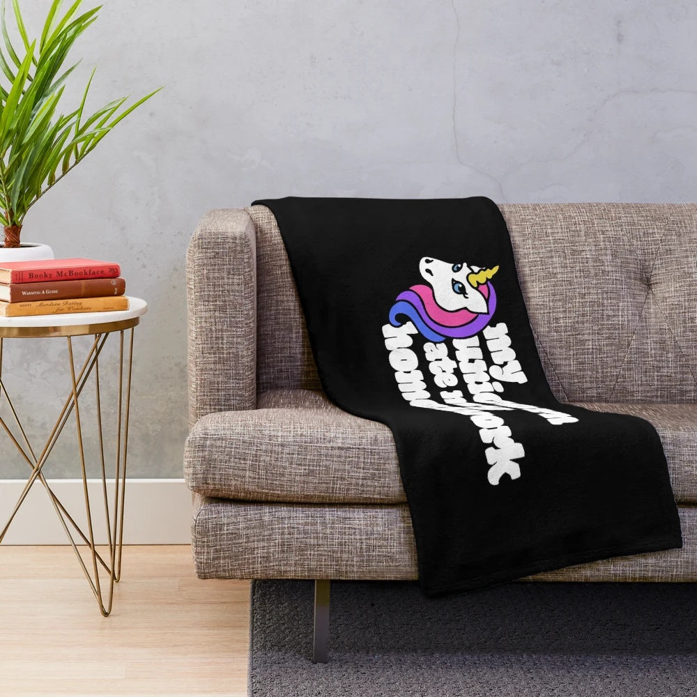 Colorful plush unicorn blanket with retro-inspired whimsical design